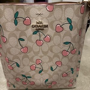 Coach Mollie Bucket Bag with Cherry Print. New condition, carried once.